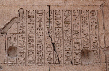 Ancient egyptian hieroglyphs carved at Karnak temple in Luxor 