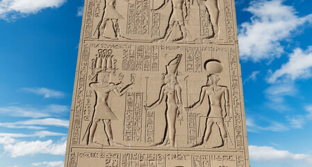 Ancient egyptian carvings and hieroglyphs carved on walls of Karnak temple in Luxor, Egypt 