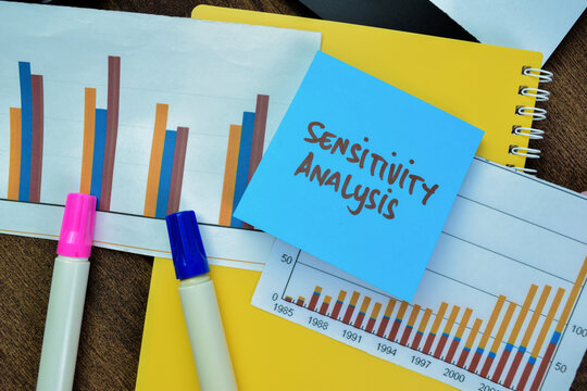 Concept of Sensitivity Analysis write on sticky notes isolated on Wooden Table.