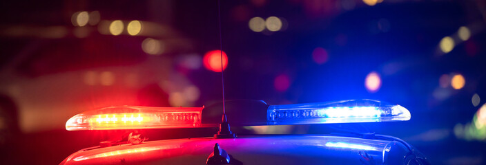 Police car with flashing lights on