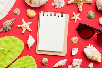Fototapeta na wymiar Blank writing book with summer beach accessories on background, copy space. Flat lay with copy space
