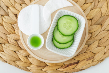 Cucumber slices and cucumber juice. Ingredients for preparing homemade face toner or beauty eye...
