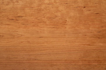 Wooden board desktop. Cherry wood wood board long desktop background. Wide solid wood desktop. The natural texture of the wooden board.	