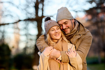 Embraced mid adult couple in the park