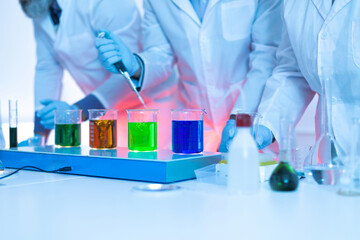 researcher in biochemistry laboratory testing chemical