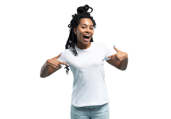 Smiling African American woman wearing white t-shirt pointing finger at her t-shirt, satisfied...