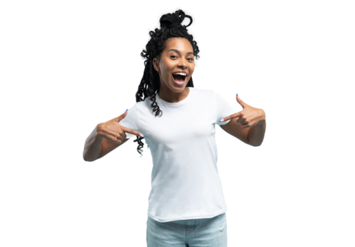 Smiling African American woman wearing white t-shirt pointing finger at her t-shirt, satisfied young female client customer showing great shopping offer, sale, isolated on transparent background