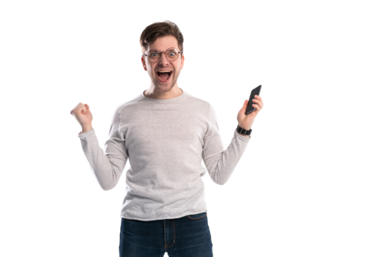 Happy man holding smartphone and celebrating his success over transparent background