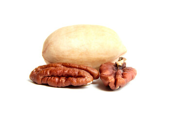 Pecan nut in shell and peeled pecan kernel isolated on a white. Whole and half of pecan nut
