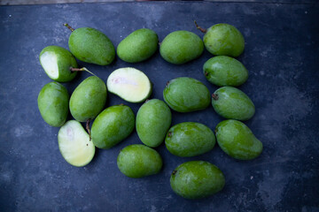 Some Fresh Raw Green Mango on the concrete floor