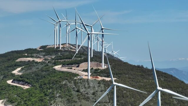 Aerial view wind turbines in Montenegro, Ulcinj. Long focal lens static shot. Sunny summer day.