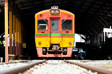 The diesel train parked at Mae Klong Train Station in Samut Songkhram and waited for the passenger to depart to Bangkok. Mae Klong train station is the destination of Rom hub market