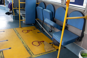 Empty seats for disabled people in a city bus, Bangkok, Thailand