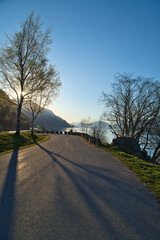 Parking lot overlooking the road, the Nordfjord and Bergen in Norway. Sun rays