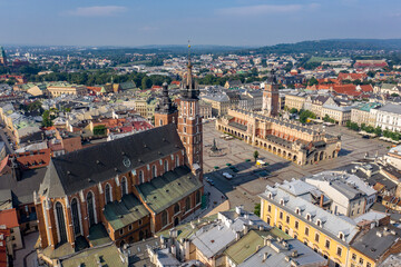Fototapeta na wymiar Saint Mary's Basilica and Kraków Cloth Hall - drone aerial view - Main Market Square on sunny day, Poland, Main Market Square