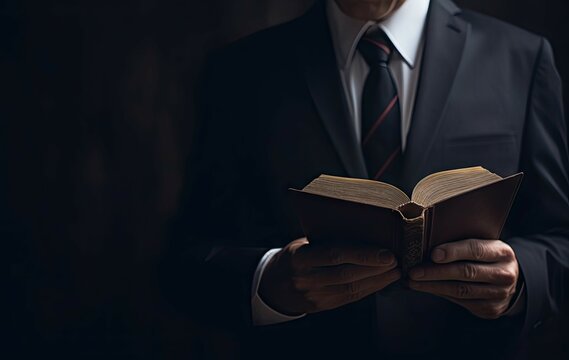 Businessman studying a book. Closeup of a male in a suit reading for work. Generative AI illustrations.