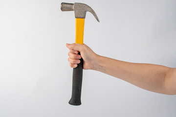 Hand with hammer on white background.
