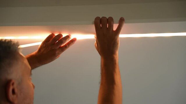 Installation of led strip,installation of decorative light closeup