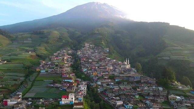 Drone view of beautiful place called Nepal Van Java on the slope of Mount Sumbing. House of village that build on the slope of mountain. Colorful house of village - 4K Aerial footage
