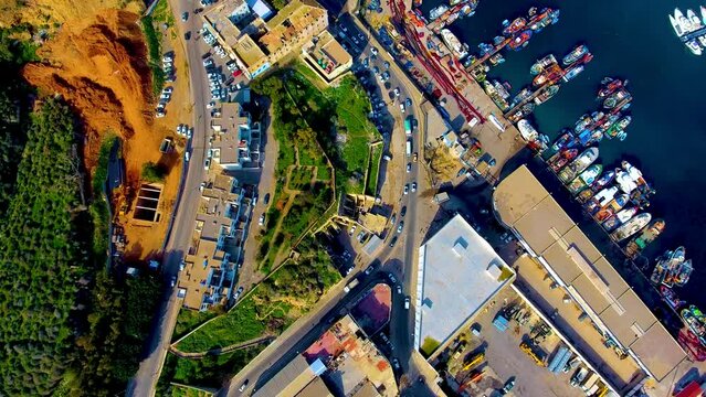 high angle shot of road traffic and the fishing port of oran algeria