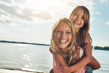 Family, children and a mother with her daughter on the beach during summer for bonding on vacation....
