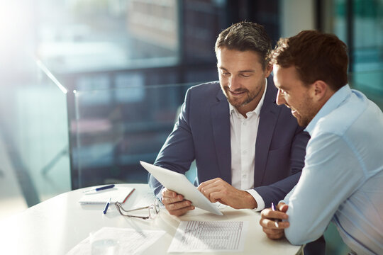 Tablet work, happy and business people in meeting for planning, collaboration and strategy. Smile, speaking and corporate men reading information on technology for a plan, ideas or teamwork in office - Powered by Adobe