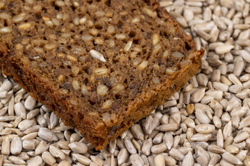 Black rye bread cut into chunks with sunflower seeds