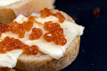 red salmon caviar with white bread and butter