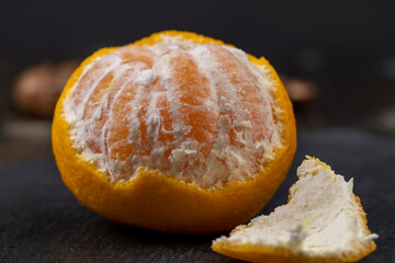 Peeled tangerines on the table, close up