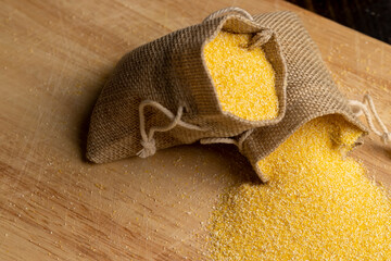 Linen bag of small size with dry corn flour for cooking porridge