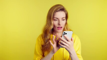 Woman, mobile cell phone, say Yes and celebration for winning, discount or sale on pink studio background. Excited female lady with smartphone for social media, online streaming, news and internet