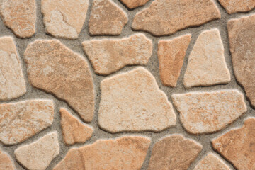 Cement wall on which a stone pattern is extruded texture background
