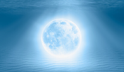 Naklejka na ściany i meble Full moon under water on the blue tropical beach 
