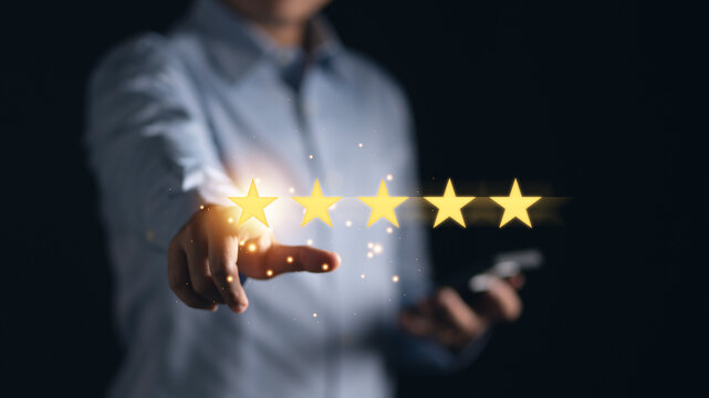 Man pointing at five stars icons, representing positive customer satisfaction concept. Excellent quality, user experience, and service evaluation for branding and marketing success
