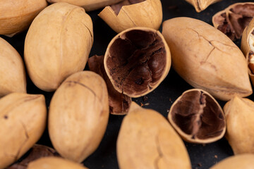Unpeeled crunchy pecans close up