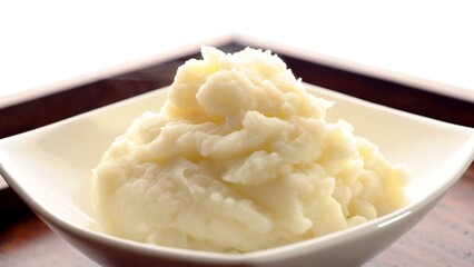 Smooth and Creamy: Top-View Close-up of Mashed Potatoes Served in a Plate