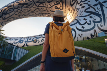 20 March 2023, Dubai, UAE: happy Tourist asian woman near Museum of The Future - New Attraction in...