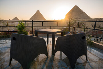 Great Pyramids of Chephren Khafra and Cheops Khufu and Mikerina Menkaura. Sunset on Giza plateau....