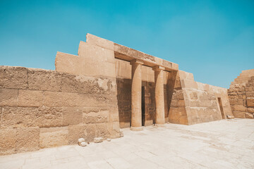 The Mortuary Temple Of Khufu at Giza Pyramid complex revealing part of the Pyramid of Khufu in the background, Giza, Great Cairo, Egypt