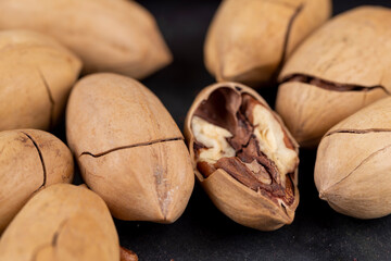Unpeeled crunchy pecans close up