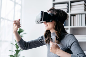 Businesswoman with vr headset lifestyle concept, Businesswoman smiling and wearing VR headset to playing boxing game with experience virtual reality while relaxation with technology after working