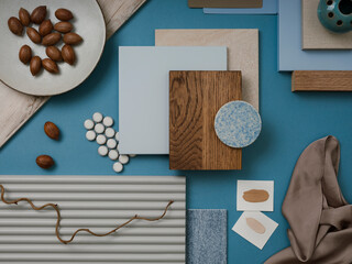 Elegant  flat lay composition in blue, brown and beige color palette with textile and paint samples, lamella panels and tiles. Architect and interior designer moodboard. Top view. Copy space. .