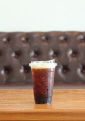 cup of iced coffee on table at cafe