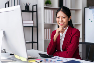 Businesswoman in suit thoughtful about accounting of new busines