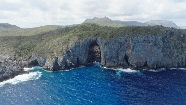 Aerial view around a large sea cave in La Puerta, Cabo Cabron, Dominican repulic