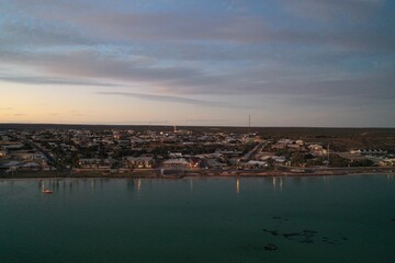 An aerial view of the coastline near sunset