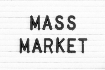 Black color letter in word mass market on white felt board background