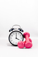 Dumbbells with a clock. Workout reminder