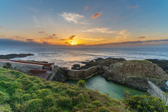 Natural pools at sunset in the tourist village of Tapia de Casariego, in Asturias, Spain.