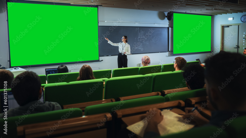 Poster young female teacher giving a lecture, showing slides on a green screen mock up display to a diverse
